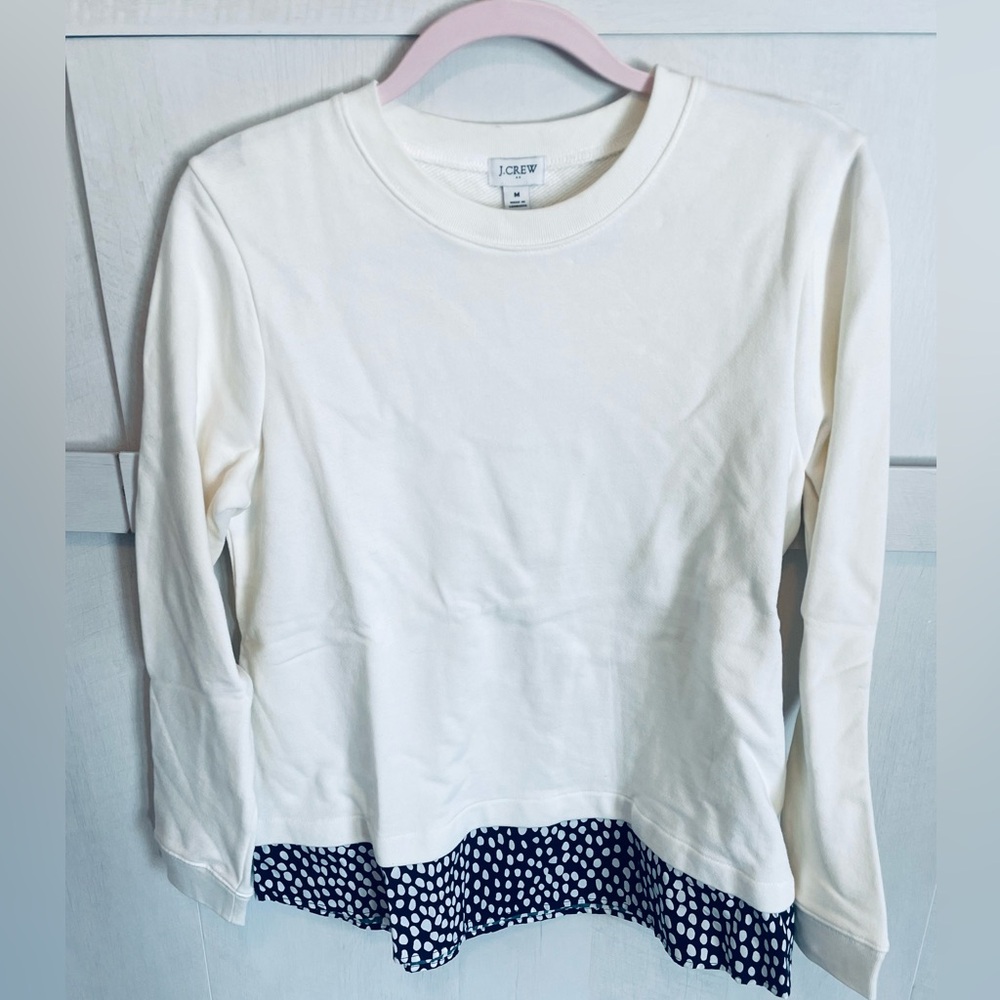 JCrew off white crewneck top with black and white spotted woven hem